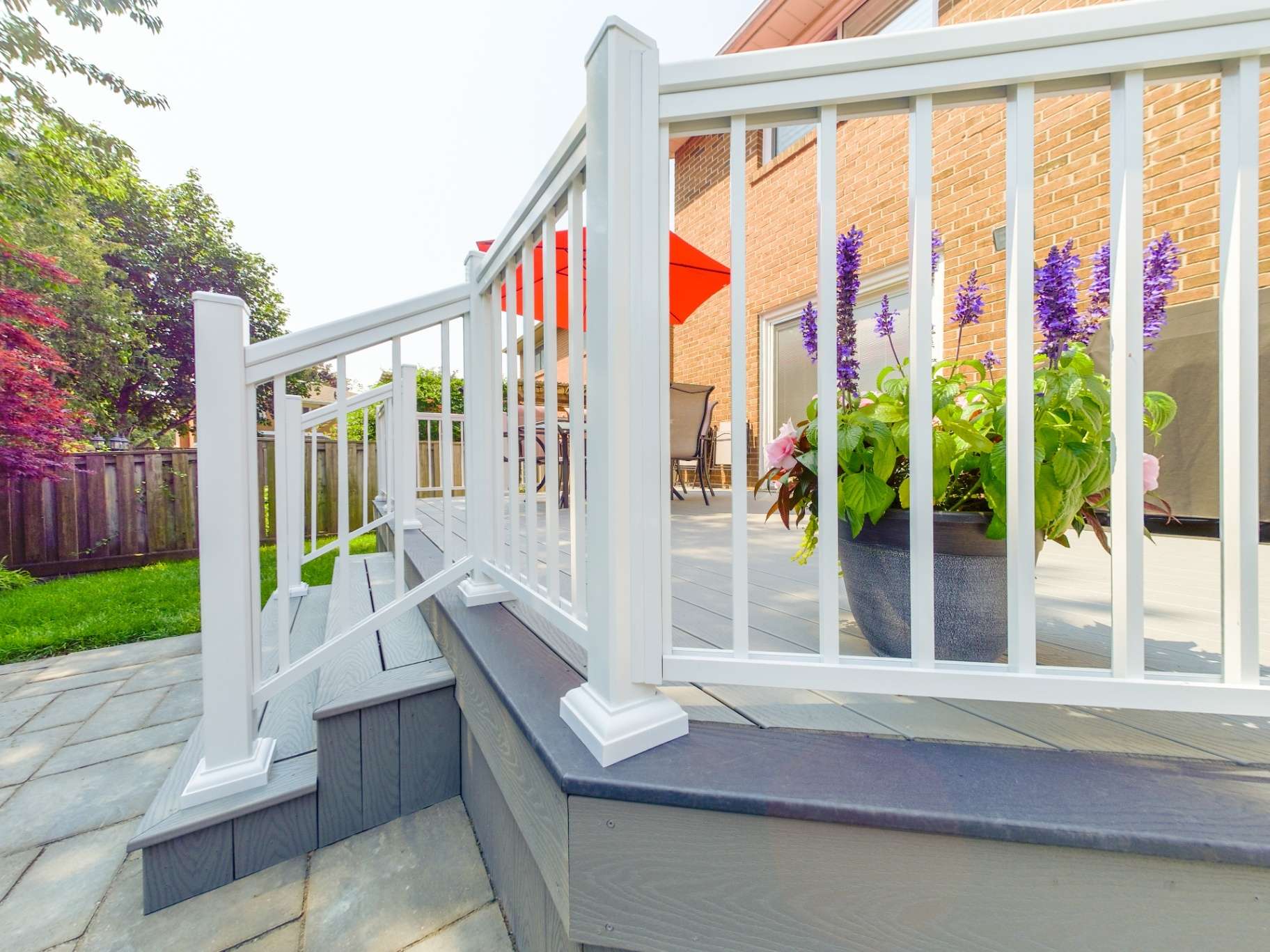 Low-maintenance composite deck with white railing