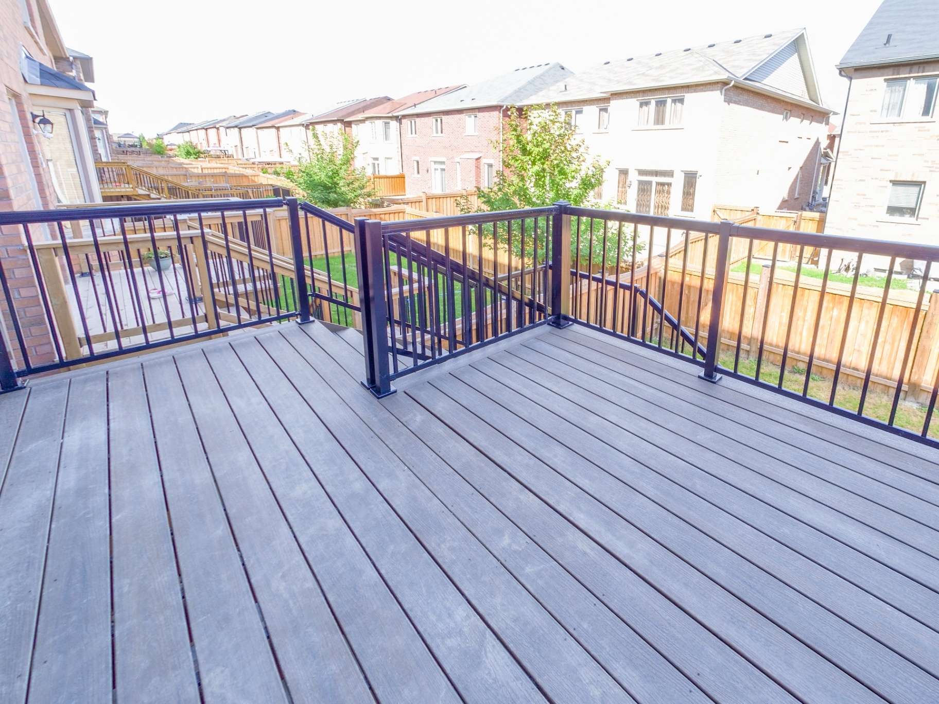 Deck with secure dark railing built to code