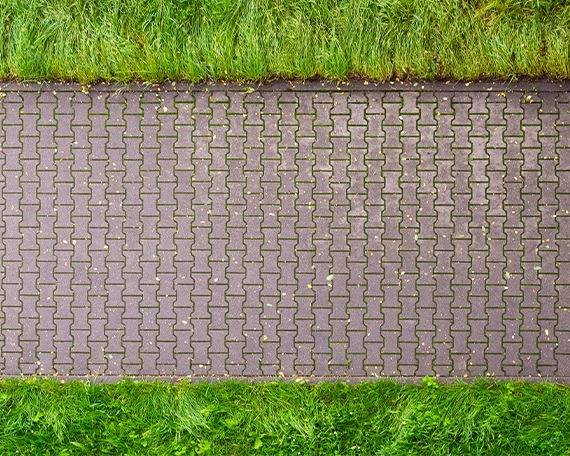 Close-up of interlock pavers — individual stones can be lifted and replaced